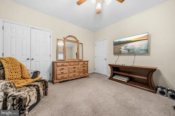 a bedroom with a bed and closet
