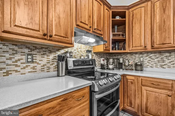 a kitchen with stainless steel appliances granite countertop a stove and a sink