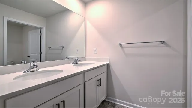 a bathroom with a tub sink double and mirror
