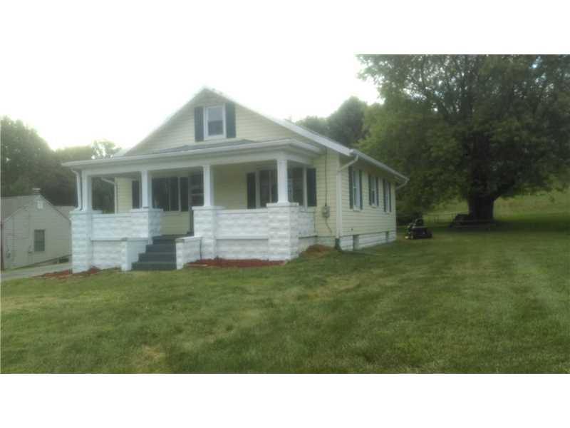 1079 Rostraver Road Belle Vernon, PA 15012 - Photo 1 of 22 Exterior Front. freshly painted porch and block w/ new mulch