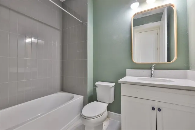 a bathroom with a toilet a sink and a bathtub