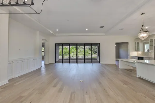 a view of an entryway with wooden floor and windows