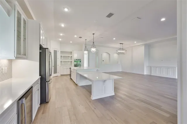 a view of a kitchen with a sink cabinets and window