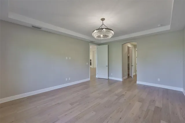 a bathroom with a double vanity sink a mirror and a bathtub