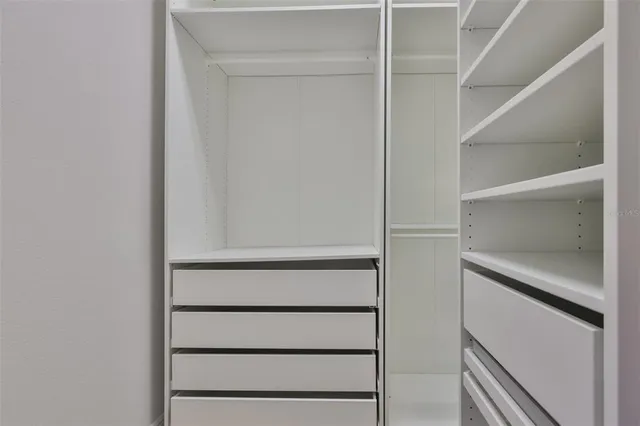 a bathroom with a shower sink and mirror