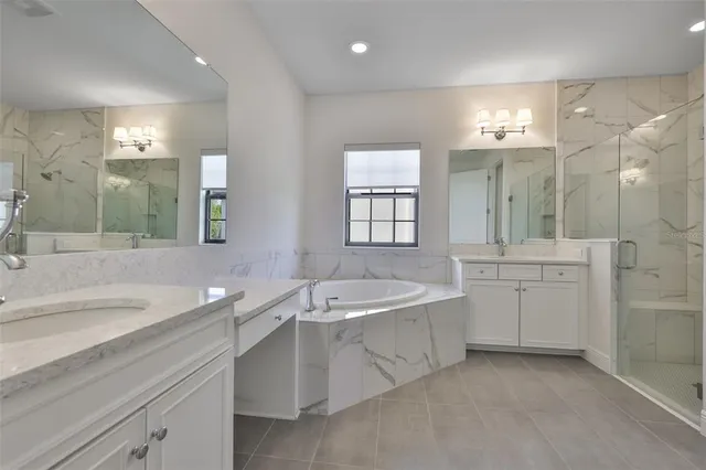 a view of a garden with a bench in the back yard