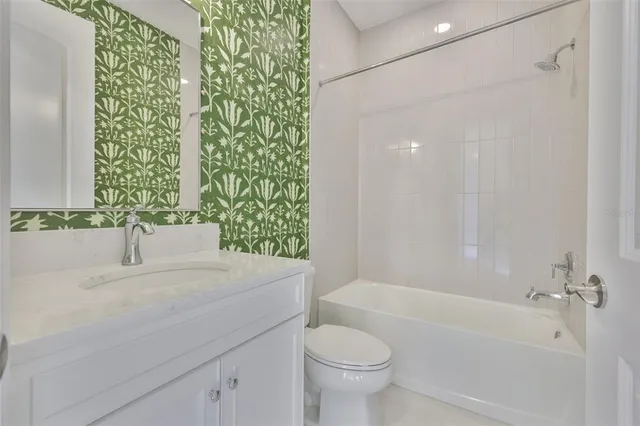 a bathroom with a sink a toilet and a bathtub