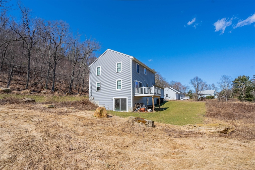521 Brimfield Road Warren, MA 01083 - Photo 30 of 41 a view of a house with a yard