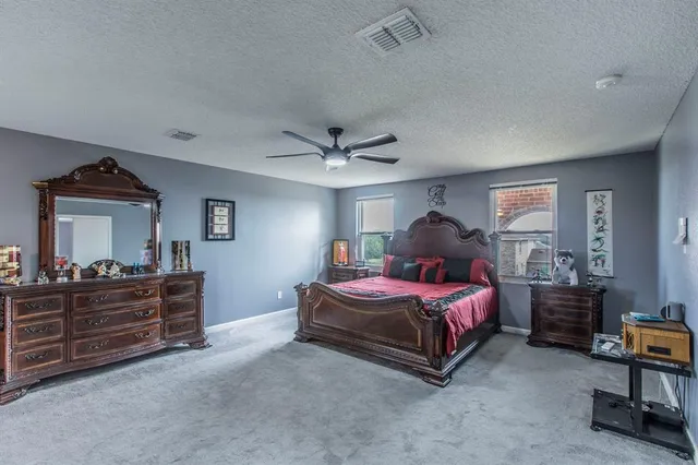 a view of a dining room with furniture and window