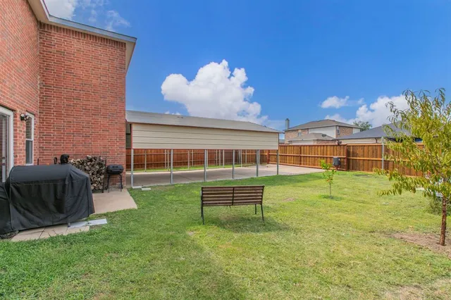 a front view of house with yard and entertaining space