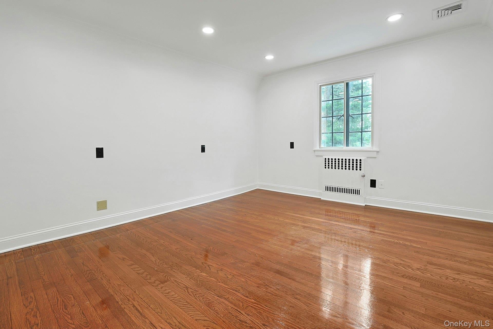 14 Withington Road Scarsdale, NY 10583 - Photo 28 of 41 an empty room with wooden floor and windows
