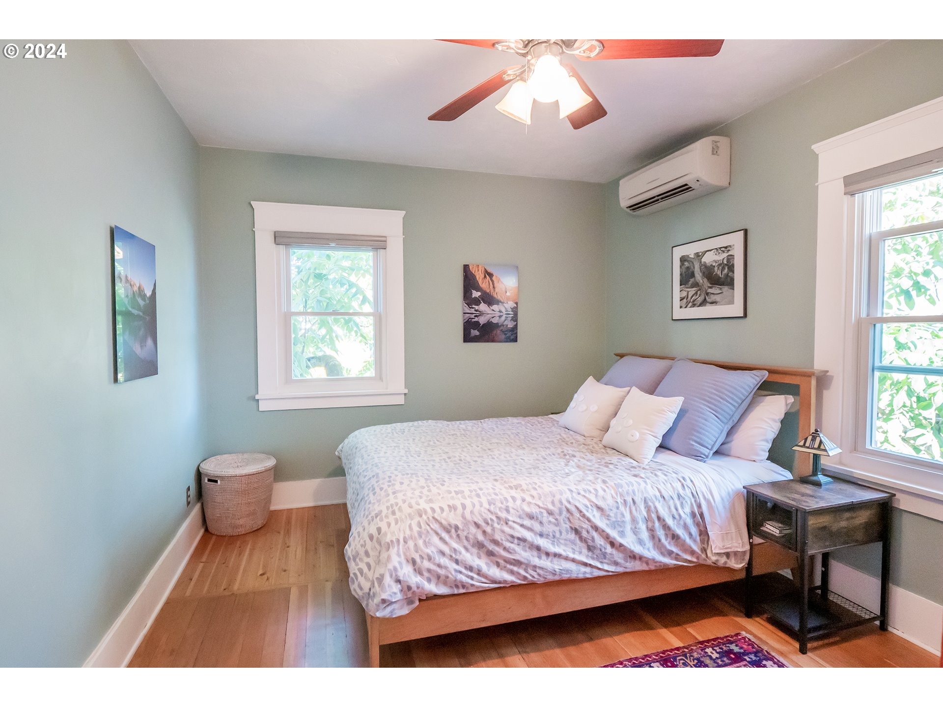 327 Clark Street Eugene, OR 97401 - Photo 12 of 42 a bedroom with a bed and wooden floor
