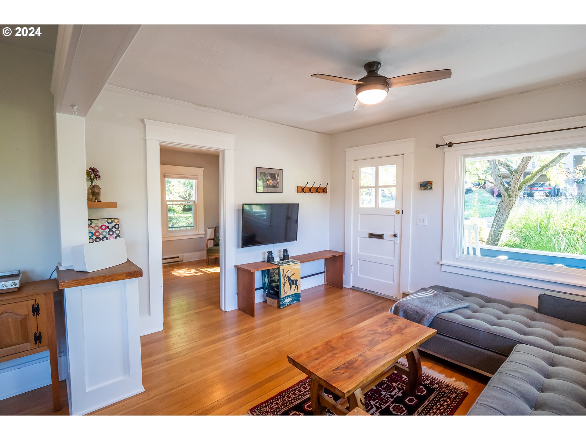 327 Clark Street Eugene, OR 97401 - Photo 16 of 42 a living room with furniture and a flat screen tv