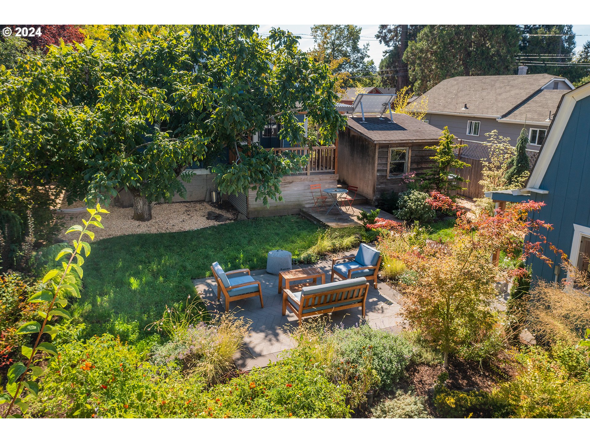 327 Clark Street Eugene, OR 97401 - Photo 29 of 42 a view of a house with backyard sitting area and garden