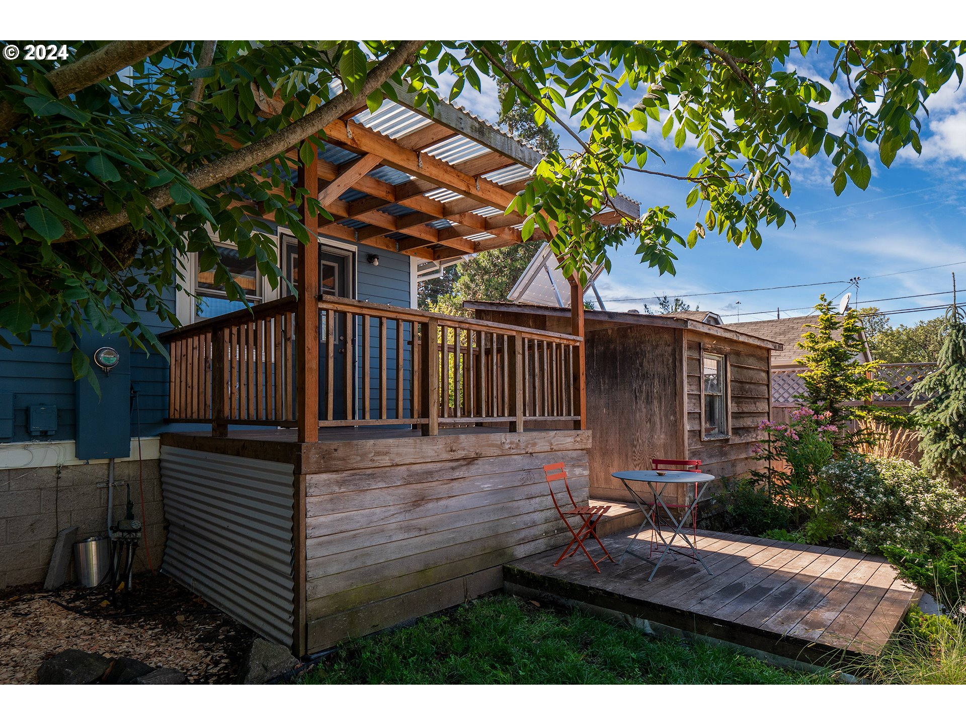 327 Clark Street Eugene, OR 97401 - Photo 32 of 42 a view of house with backyard and a garden