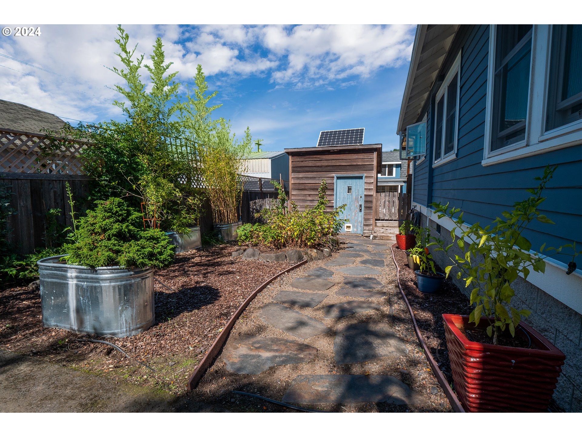 327 Clark Street Eugene, OR 97401 - Photo 34 of 42 a view of a house with a garden
