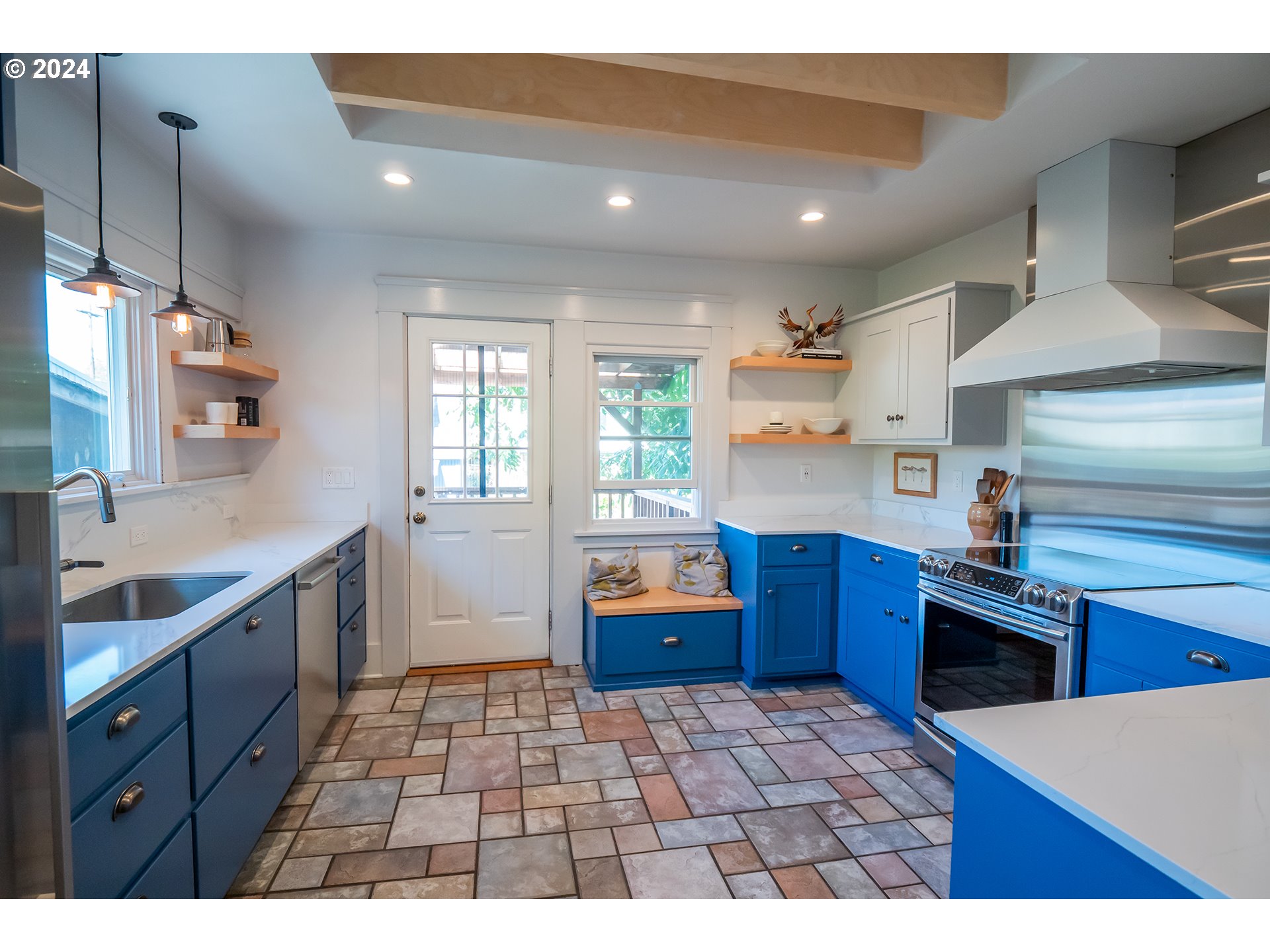 327 Clark Street Eugene, OR 97401 - Photo 9 of 42 a kitchen with stainless steel appliances granite countertop a sink stove and wooden cabinets