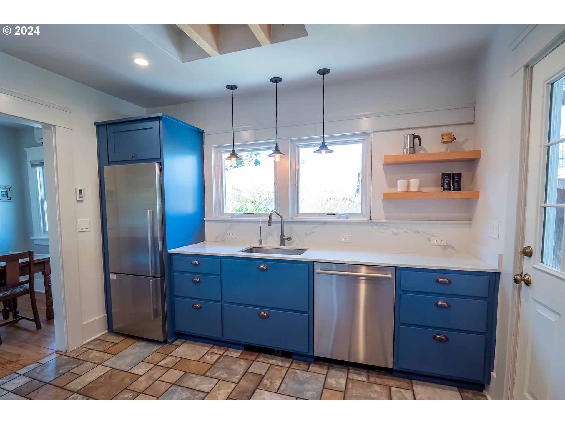 327 Clark Street Eugene, OR 97401 - Photo 10 of 42 a kitchen with stainless steel appliances granite countertop a refrigerator and a sink