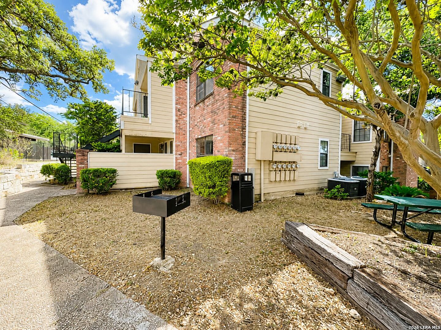 11610 Vance Jackson Road, Unit 867 San Antonio, TX 78230 - Photo 4 of 10 a view of a house with backyard and sitting area