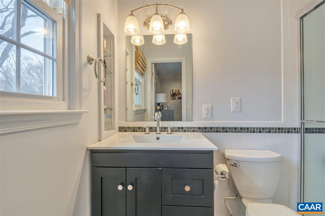 322 North Bennington Road Charlottesville, VA 22901 - Photo 23 of 39 a bathroom with a sink vanity mirror and toilet