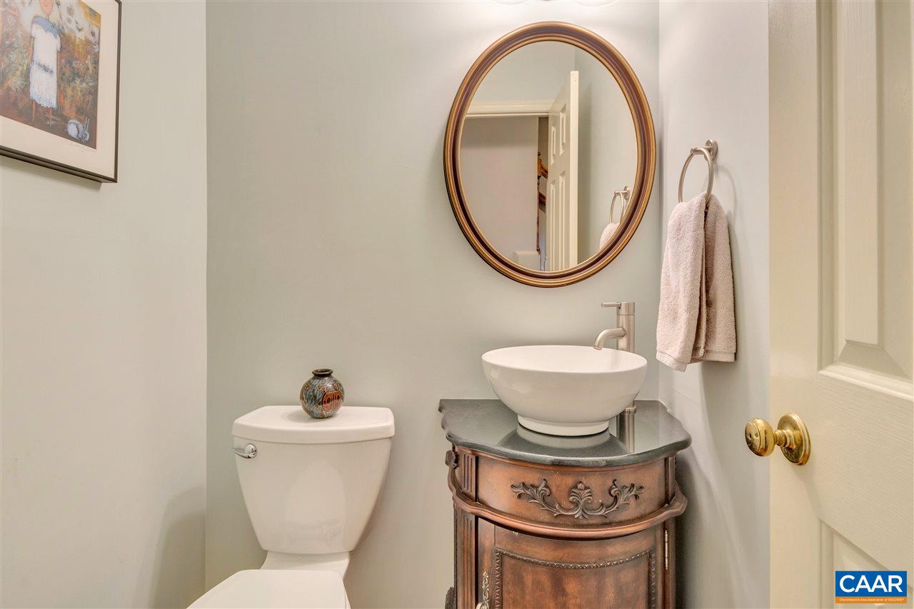 322 North Bennington Road Charlottesville, VA 22901 - Photo 4 of 39 a bathroom with a toilet a sink and a mirror