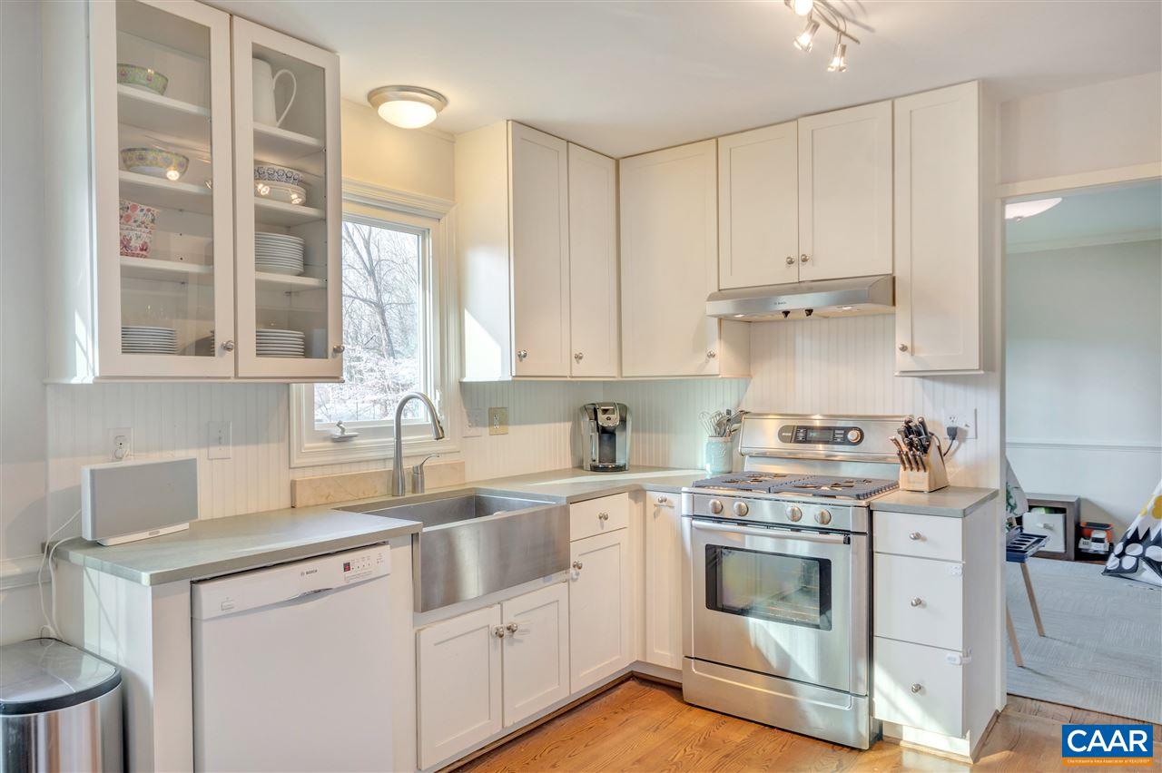 322 North Bennington Road Charlottesville, VA 22901 - Photo 8 of 39 a kitchen with white cabinets and white appliances