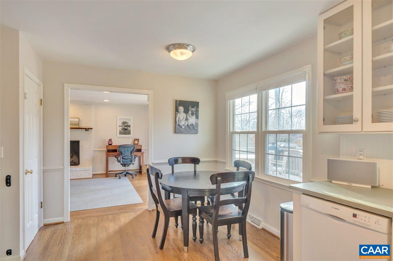 322 North Bennington Road Charlottesville, VA 22901 - Photo 10 of 39 a view of a dining room with furniture and a potted plant