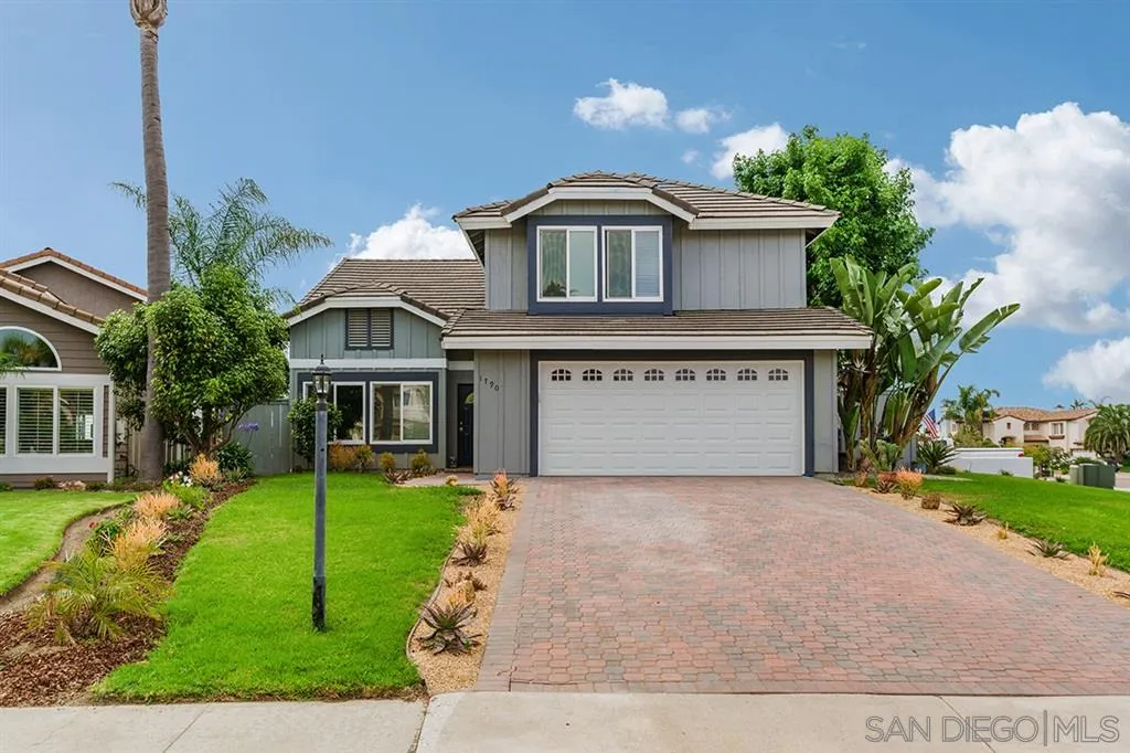 1790 Hawk View Drive Encinitas, CA 92024 - Photo 3 of 25 a front view of a house with a yard and garage