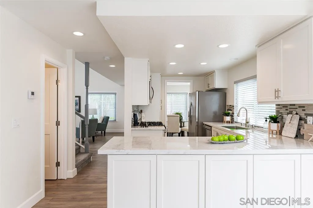 1790 Hawk View Drive Encinitas, CA 92024 - Photo 8 of 25 a kitchen with lots of counter top space and stainless steel appliances