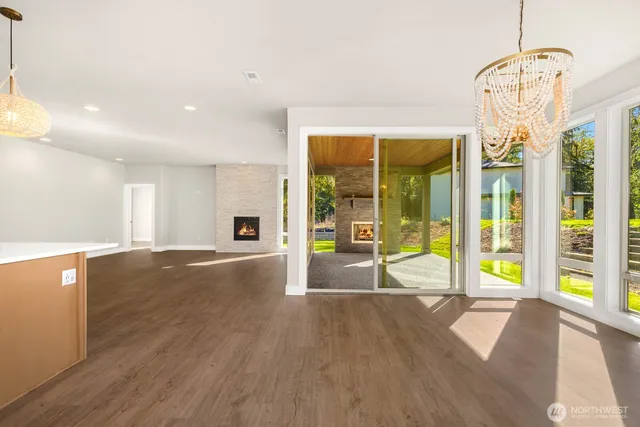 a view of an entryway with wooden floor