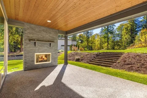 a view of a back yard with a wooden fence