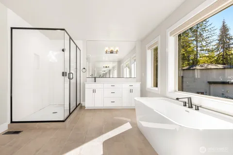 a bathroom with a bathtub and a sink
