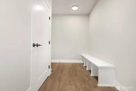 a view of a bathroom with wooden floor