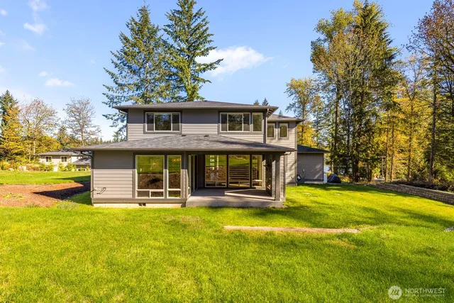 a view of a swimming pool with an outdoor space and seating area
