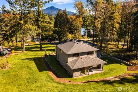 a view of a swimming pool with an outdoor space and seating area
