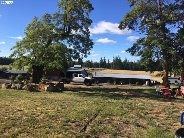 537 Cedar Valley Road Goldendale, WA 98620 - Photo 5 of 24 a view of a house with a yard and sitting area