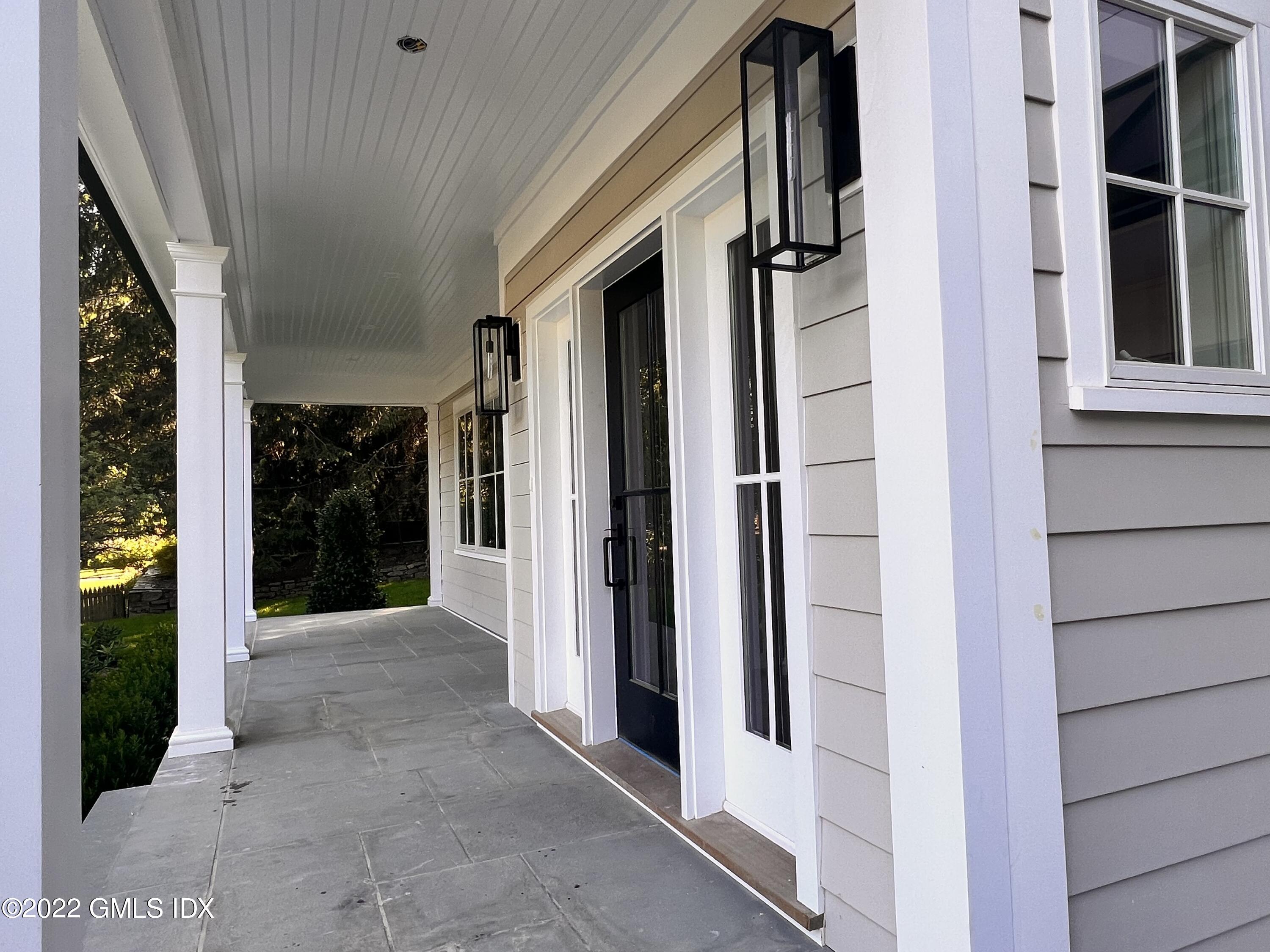 27 Skylark Road Greenwich, CT 06830 - Photo 3 of 25 a view of a entryway door front of house