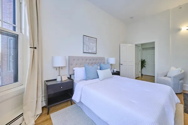 a bed room with a bed and a tv