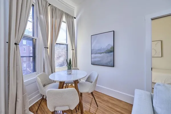 a view of a dining room with furniture window and outside view