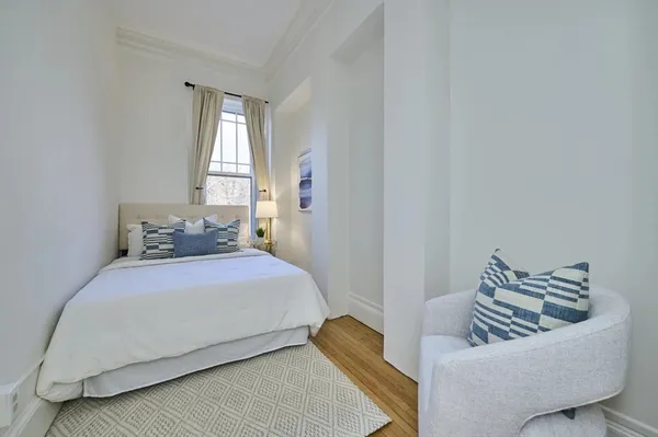 a bedroom with a couch and a couch