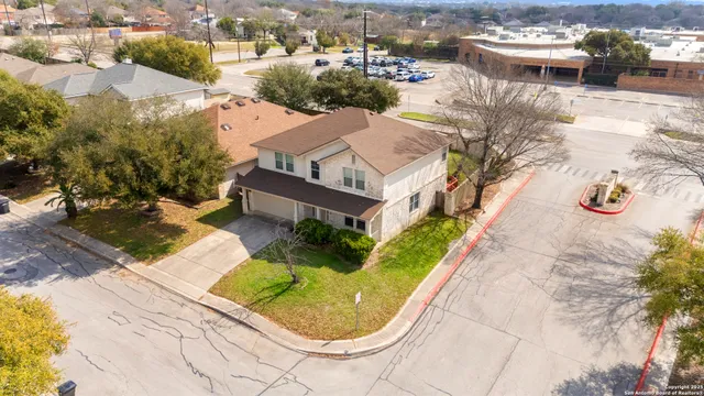 an aerial view of a house with yard swimming pool and outdoor seating