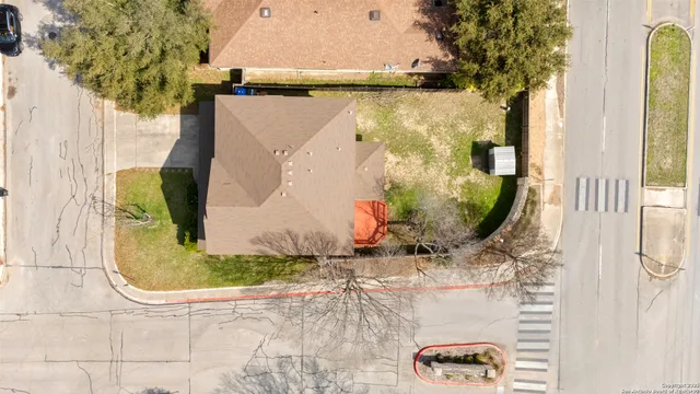 an aerial view of residential houses with outdoor space