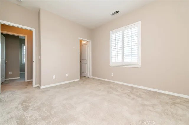 a spacious bathroom with a tub sink shower and mirror