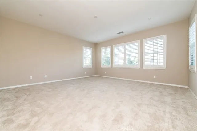 a bathroom with a tub sink shower and mirror