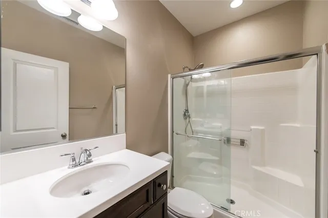 a view of a street with a building in the background