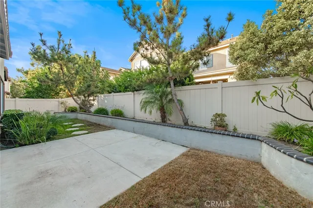 a view of a swimming pool with a table and chairs