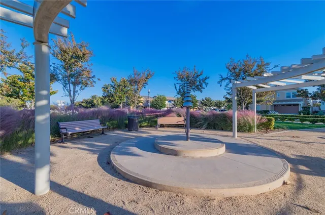 a pathway of a house with a yard