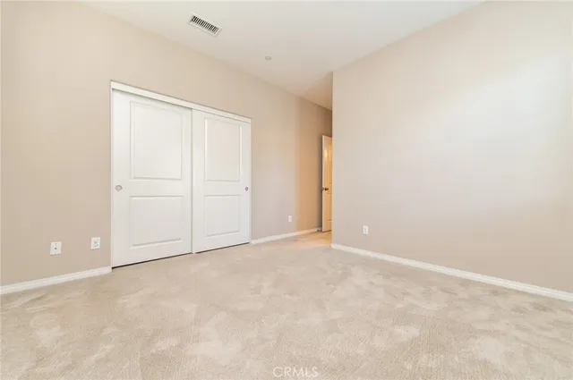 a large kitchen with stainless steel appliances granite countertop a lot of counter space