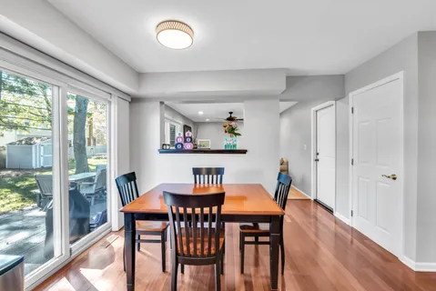 a view of a dining room with furniture window and wooden floor