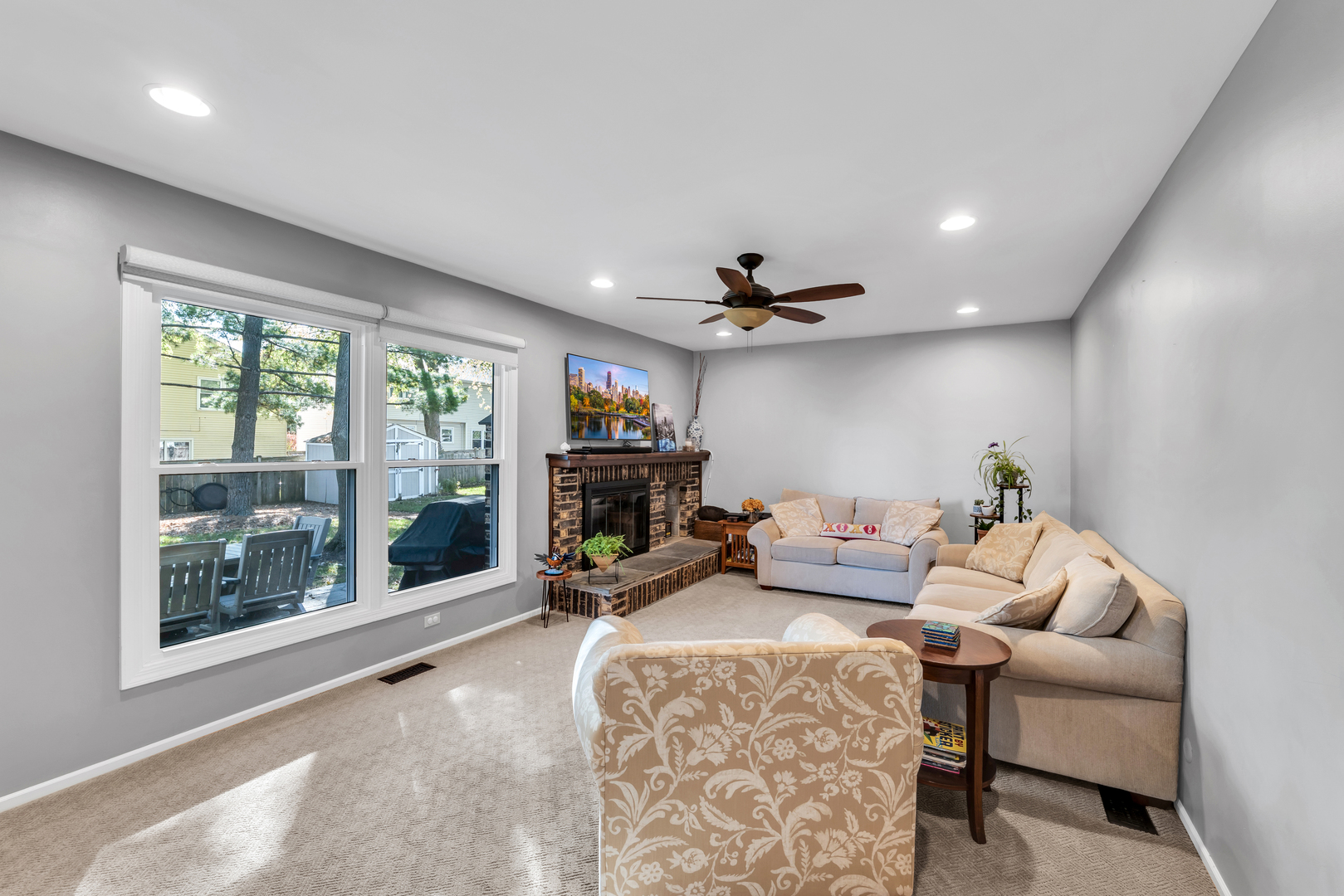 896 Chaucer Way Buffalo Grove, IL 60089 - Photo 13 of 26 a living room with furniture and a fireplace